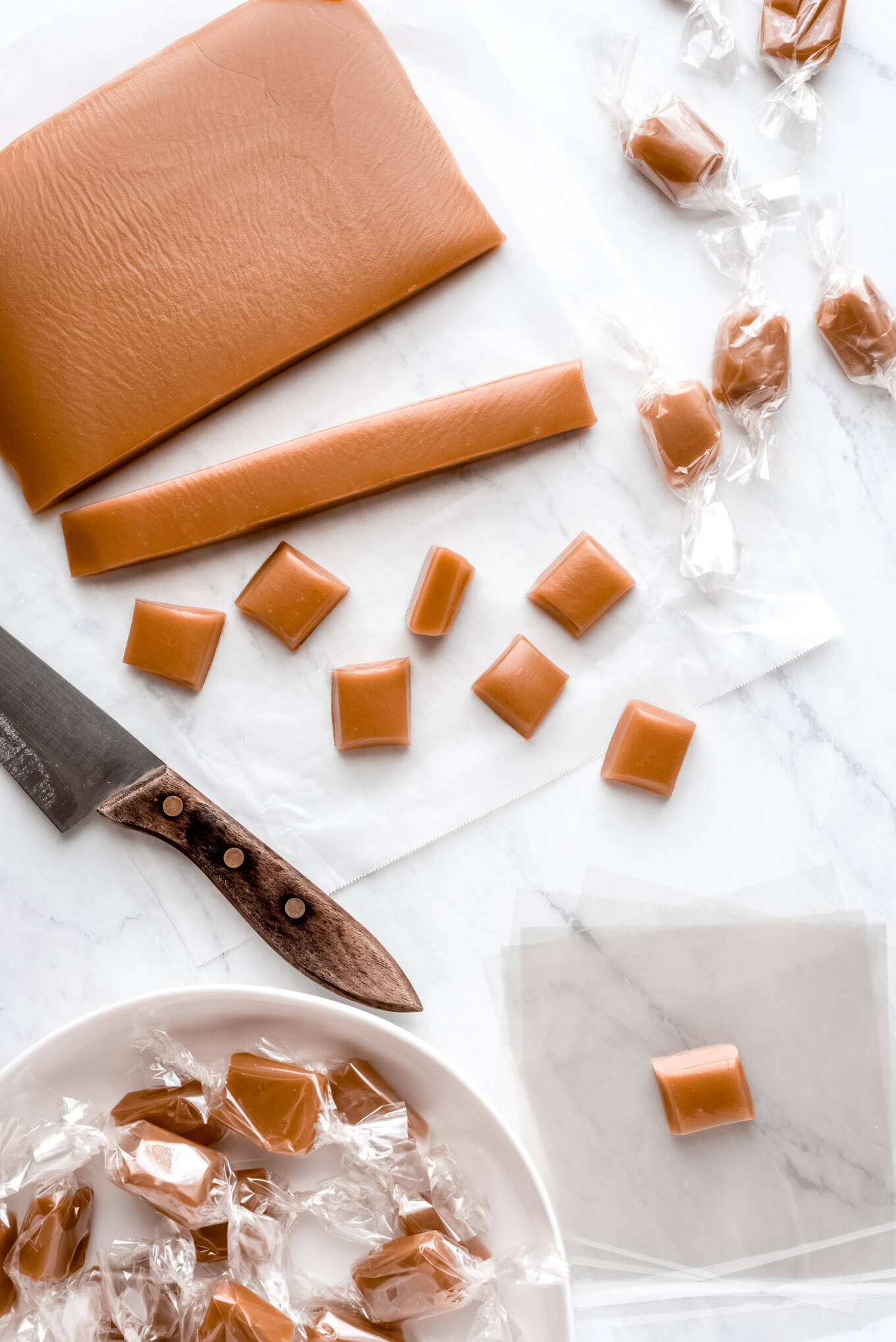 Cutting up and wrapping homemade caramels.