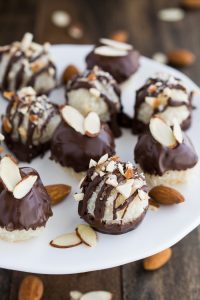 Almond Joy Macaroons- Mini macaroons stuffed with an almond and then dipped and drizzled with chocolate | Garnish & Glaze